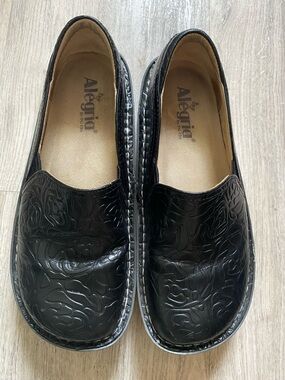 Alegria The Debra Black Embossed Floral Slip-On Clogs